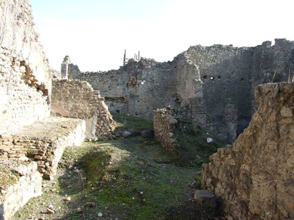 VII.11.3 Pompeii. December 2007. Looking east, the south wall with door to dwelling at VII.11.2 is on the right.