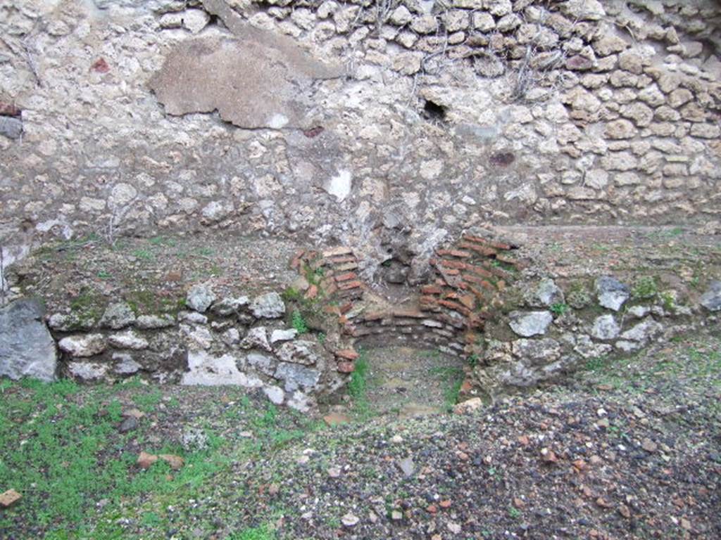 VII.11.3 Pompeii. December 2005. North wall.  Hearth and space for cauldron or tub.
