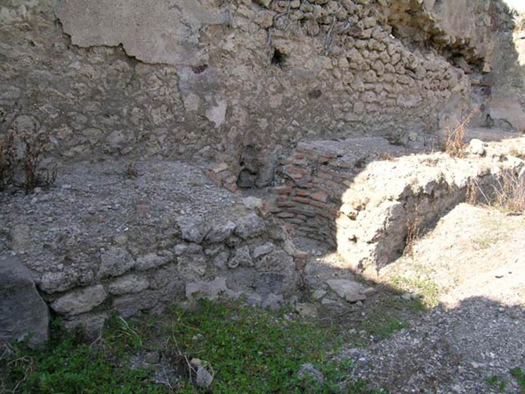 VII.11.3 Pompeii. June 2005. Looking towards north wall, hearth and space for cauldron or tub. Photo courtesy of Nicolas Monteix.
