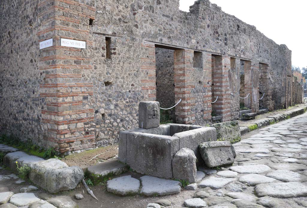 VII.11.5, Pompeii. December 2018. 
Looking south from fountain outside VII.11.5, on east side of Vicolo della Maschera. Photo courtesy of Aude Durand.
