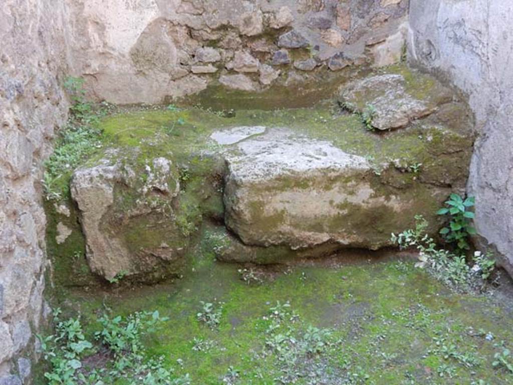 VII.11.12  Pompeii. December 2006. Cella meretricia with stone bed, under steps to upper floor.  Traces of steps are visible on the wall on the right hand side of pictures
