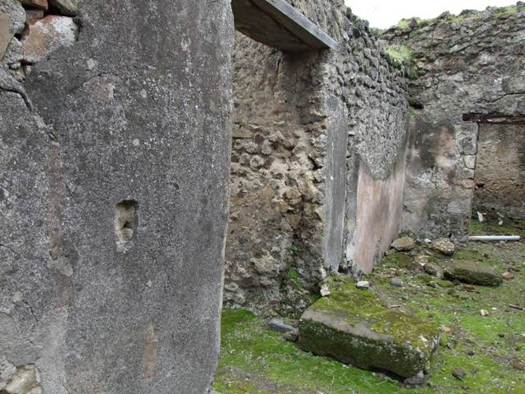VII.11.14 Pompeii. March 2009. Room 1, passageway, with doorway to entrance corridor and stone at base of staircase.