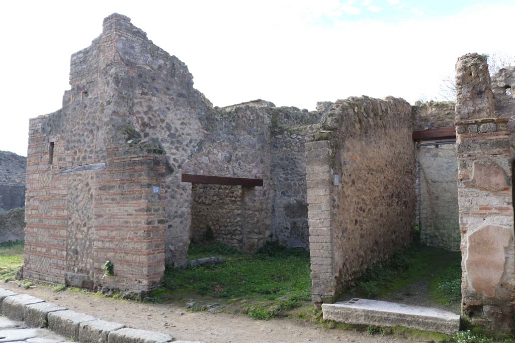 VII.11.15 Pompeii on left. December 2018. 
Looking south-west to entrances on west side of Vicolo del Lupanare. Photo courtesy of Aude Durand.

