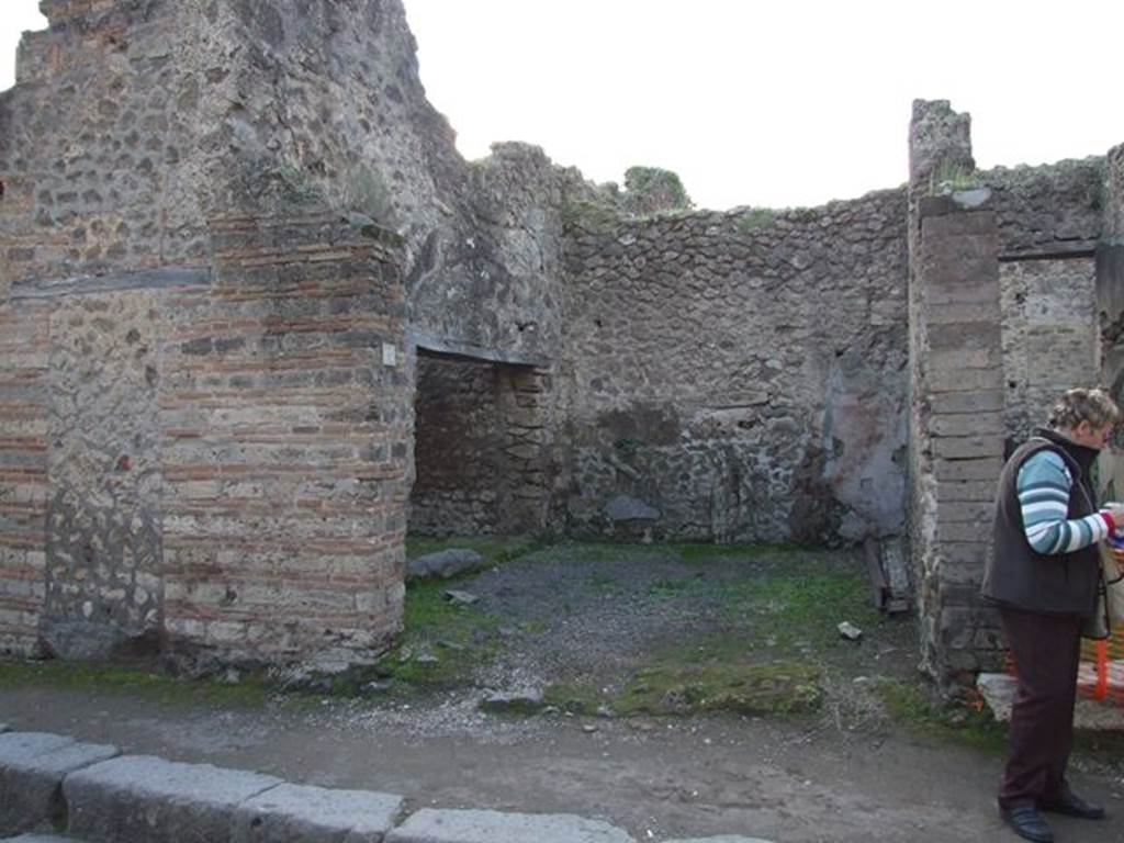 VII.11.15 Pompeii. December 2006. Entrance doorway, looking west from Vicolo del Lupanare.