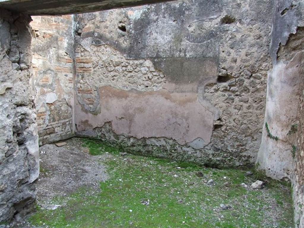VII.11.15 Pompeii. December 2006. Side room to left of entrance, looking south.  According to Eschebach, in the south-west corner was the latrine and a down-pipe from above. Site of latrine and waste pipe from upper floor on right of picture.
