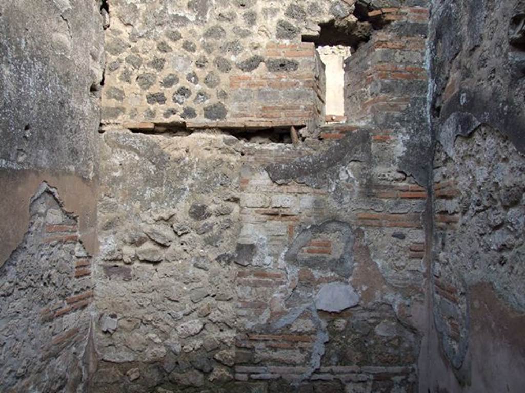 VII.11.15 Pompeii. December 2006. East wall of the side room showing inside of blocked doorway, and window.