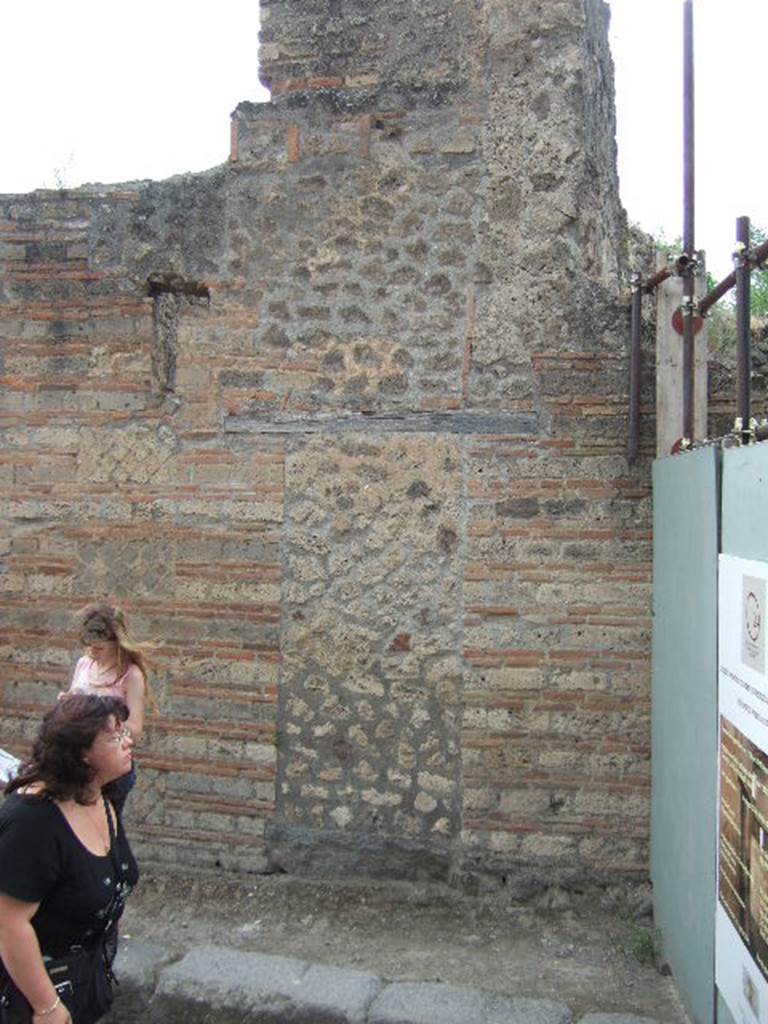Outside of blocked doorway between VII.11.16 and VII.11.15, Pompeii. May 2006.