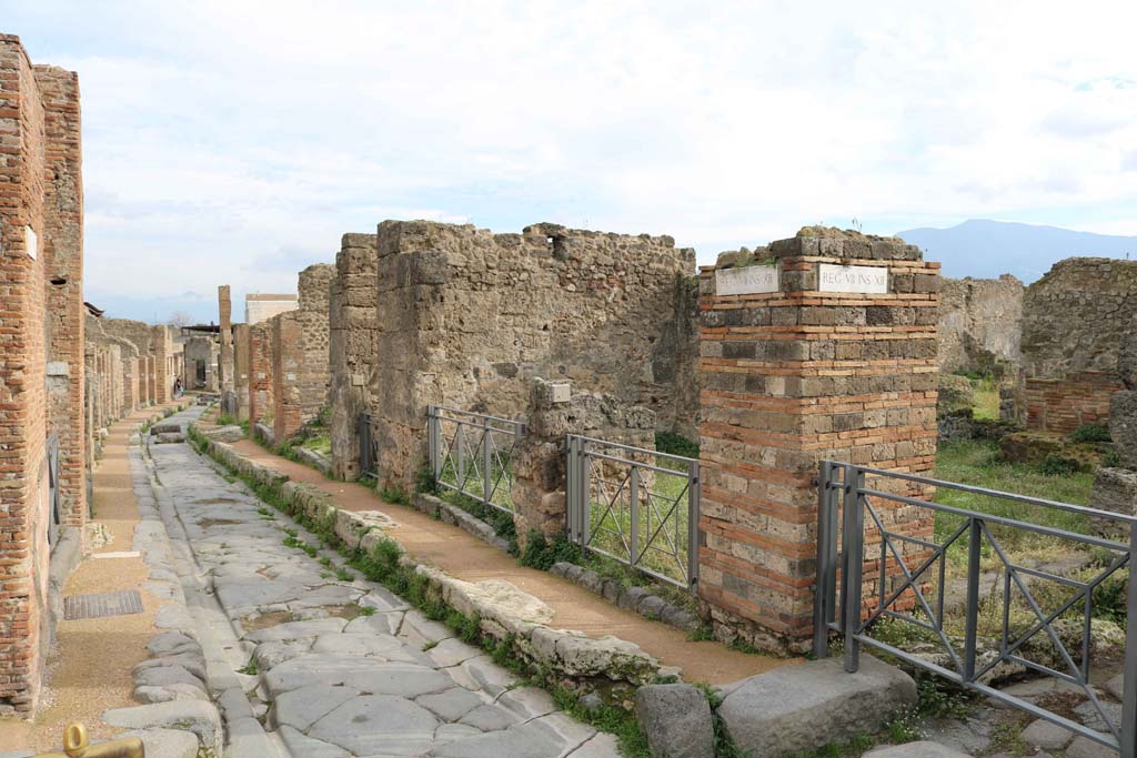 Via degli Augustali Pompeii, looking east. December 2018. 
The entrance doorway at VII.12.1 is right of centre. Photo courtesy of Aude Durand.

