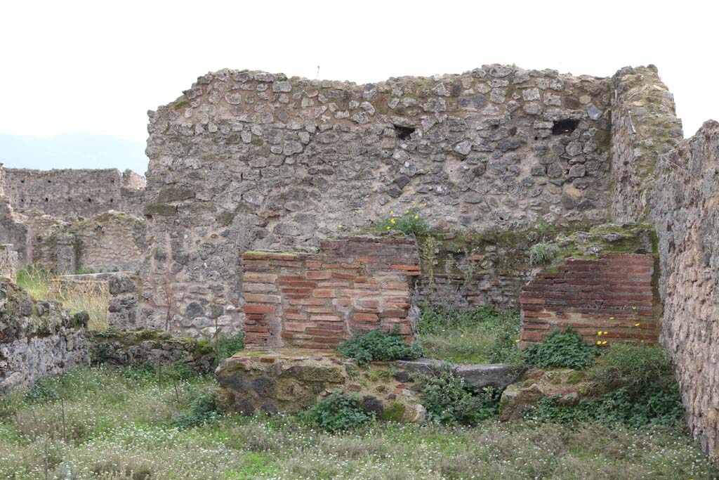 VII.12.1, Pompeii. December 2018. 
Looking towards oven. The west wall with doorway at VII.12.37 doorway, is on the right. Photo courtesy of Aude Durand.
