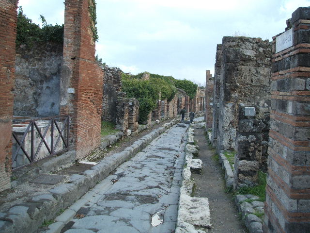 VII.2, Pompeii. December 2004. Via degli Augustali looking east.     VII.12.1   