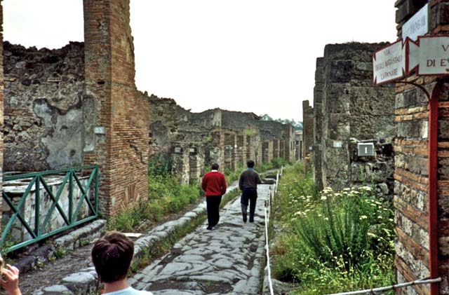 VII.2, Pompeii, on left. 1989. Looking east on Via degli Augustali, from outside of VII.12.1, on right. Photo courtesy of Anne Fettis.
