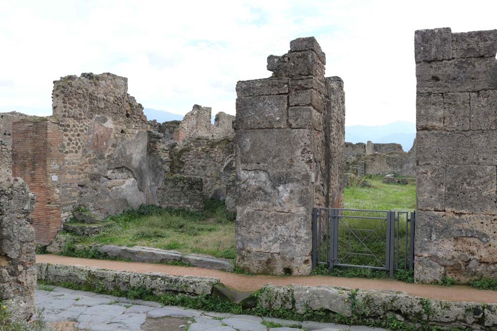 VII.12.3 Pompeii on right, and VII.12.4 on left. December 2018. 
Looking south on Via degli Augustali towards doorways. Photo courtesy of Aude Durand.

