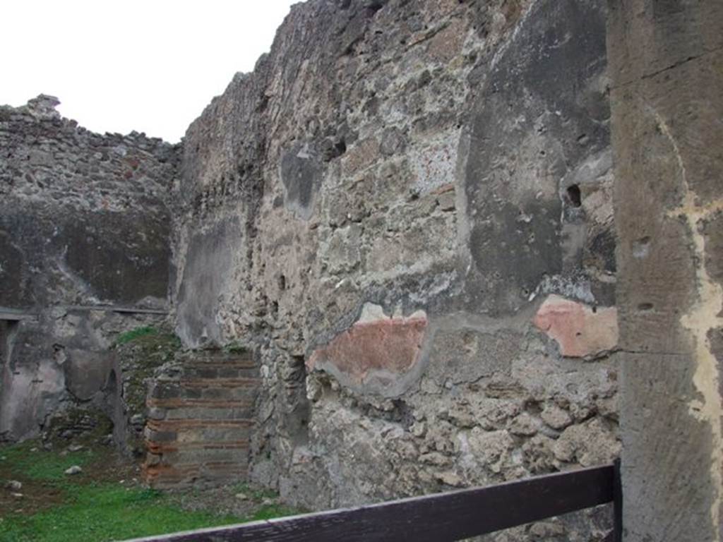 VII.12.14 Pompeii.  December 2007.  West wall, with remains of staircase at rear.