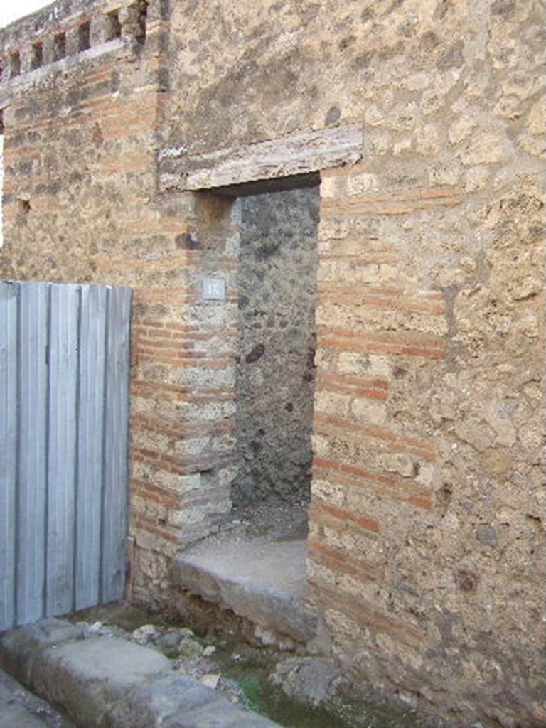 VII.12.16 Pompeii. September 2005. Looking south to entrance doorway. According to Della Corte, found to the right of the doorway were the words – Scribit Paris, idem rogat    [CIL IV 821]
He thought the entrance doorway led to steps to a hospitium on the upper floor, and that the host was named Paris.  See Della Corte, M., 1965.  Case ed Abitanti di Pompei. Napoli: Fausto Fiorentino. (p.202)
According to Epigraphik-Datenbank Clauss/Slaby (See www.manfredclauss.de), CIL IV 821 read -
A(ulum) Suettium Certum aed(ilem) o(ro) v(os) f(aciatis)
scrib(s)it Paris idem rogat
aetatis d(ignum) [r(ei) p(ublicae)] Iarin[    [CIL IV 821]

