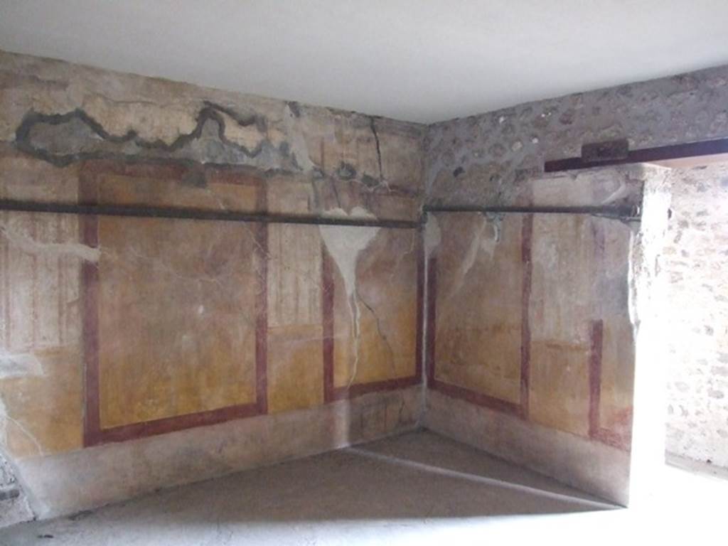 VII.12.20  Pompeii.  March 2009.  Room 4.   North east corner with painted plaster decoration.