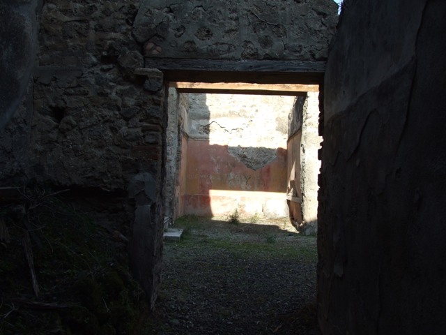 VII.12.23 Pompeii. December 2007. Plaster on street wall on both sides of entrance.