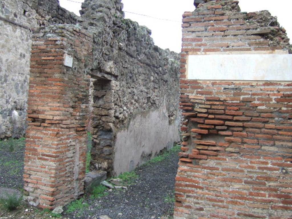 VII.12.26 Pompeii. December 2004. Entrance corridor and doorway to shop at VII.12.27, on left.