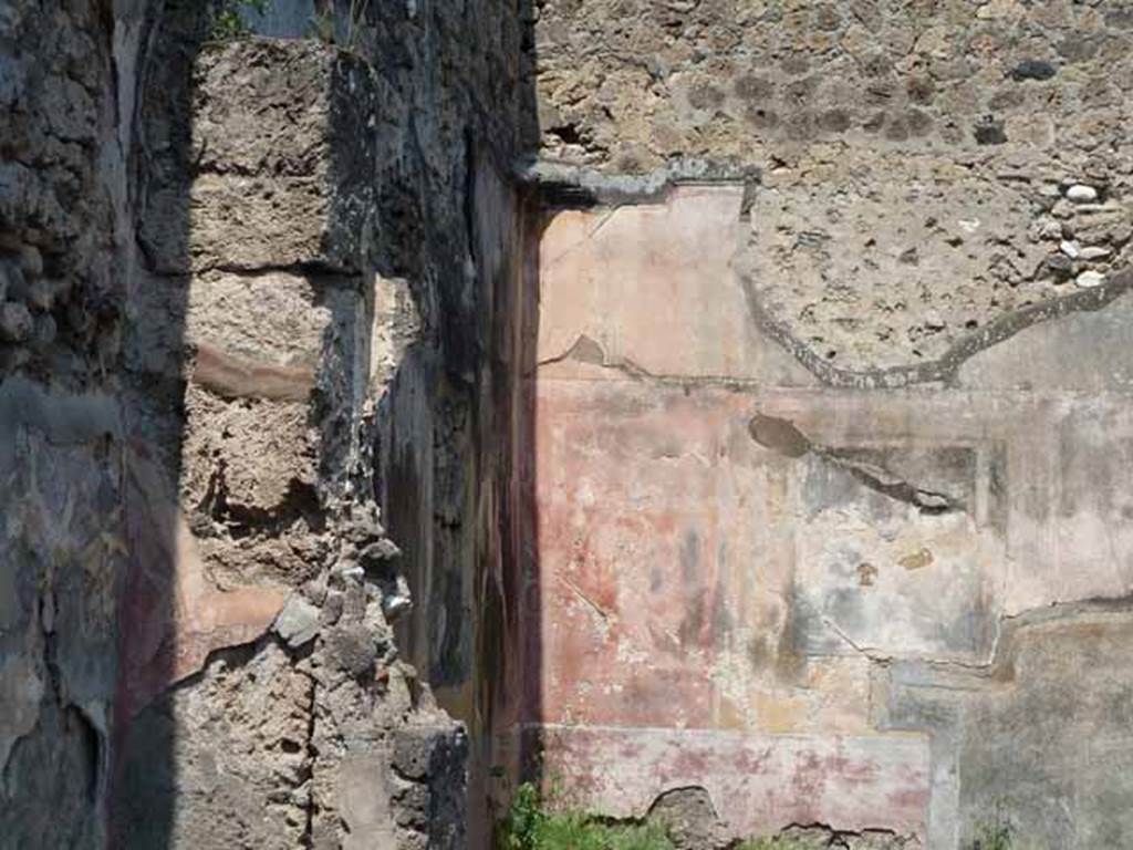 VII.12.26 Pompeii. May 2010.  West wall of triclinium, north- west corner and north wall.