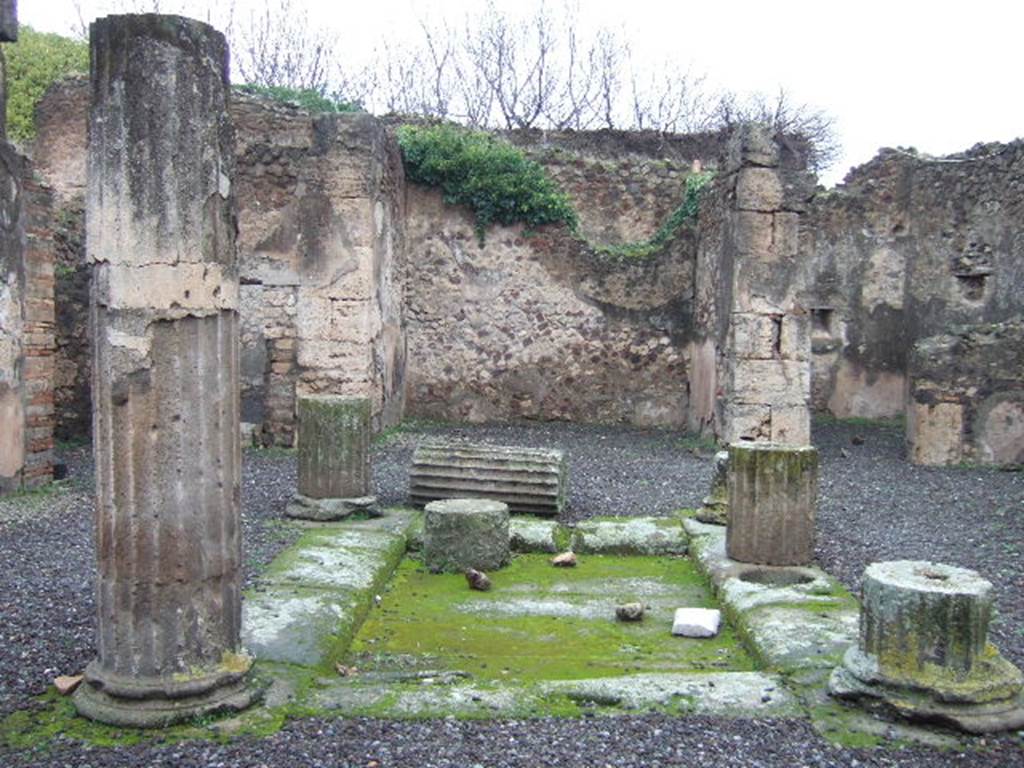 VII.13.8 Pompeii. December 2005. Looking north across impluvium in atrium to tablinum. According to Varone, written on a column in the atrium was:
Romula
hic cum
Staphylo
moratur      [CIL IV 2060]
He translated this as “Romula spent time here with Staphylos”.
See Varone, A., 2002. Erotica Pompeiana: Love Inscriptions on the Walls of Pompeii, Rome: L’erma di Bretschneider. (p.45)
