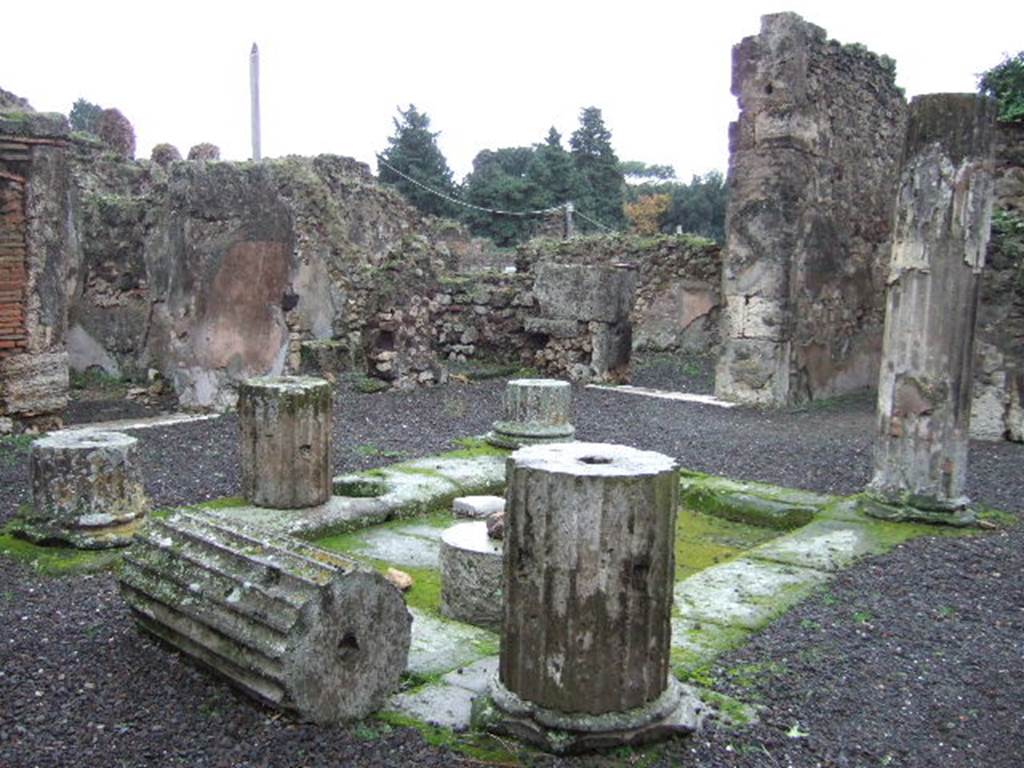 VII.13.8 Pompeii. December 2005. Atrium, impluvium and columns, looking south-east.