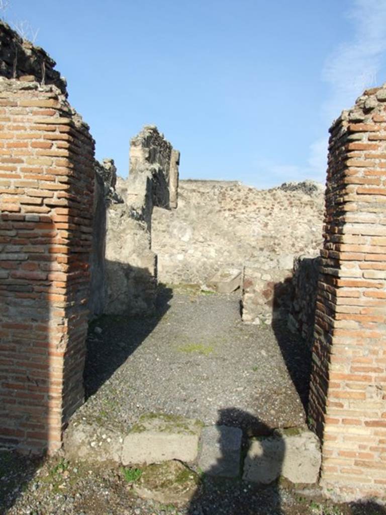 VII.13.9 Pompeii. December 2007. Looking north from shop through doorway into rear room, with a doorway in its north wall, into a yard? 