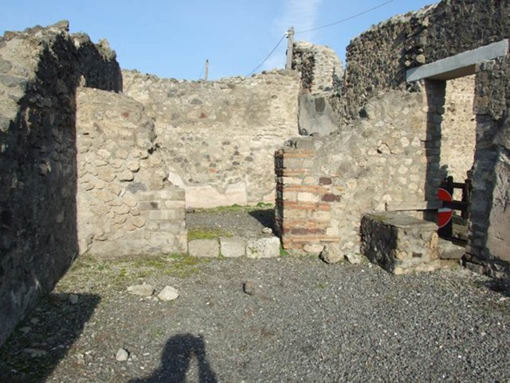 VII.13.10 Pompeii. December 2007. North wall of shop, doorway to rear room and steps at entrance VII.13.11.