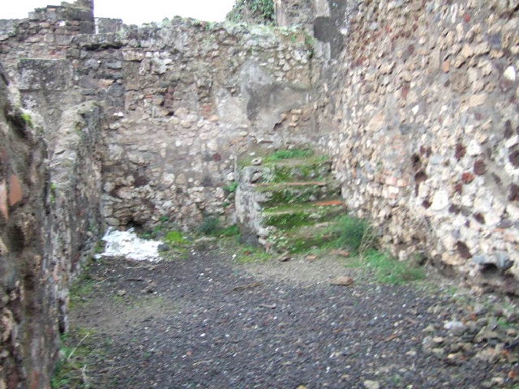 VII.13.13 Pompeii. December 2005. West wall and stairs to upper floor.