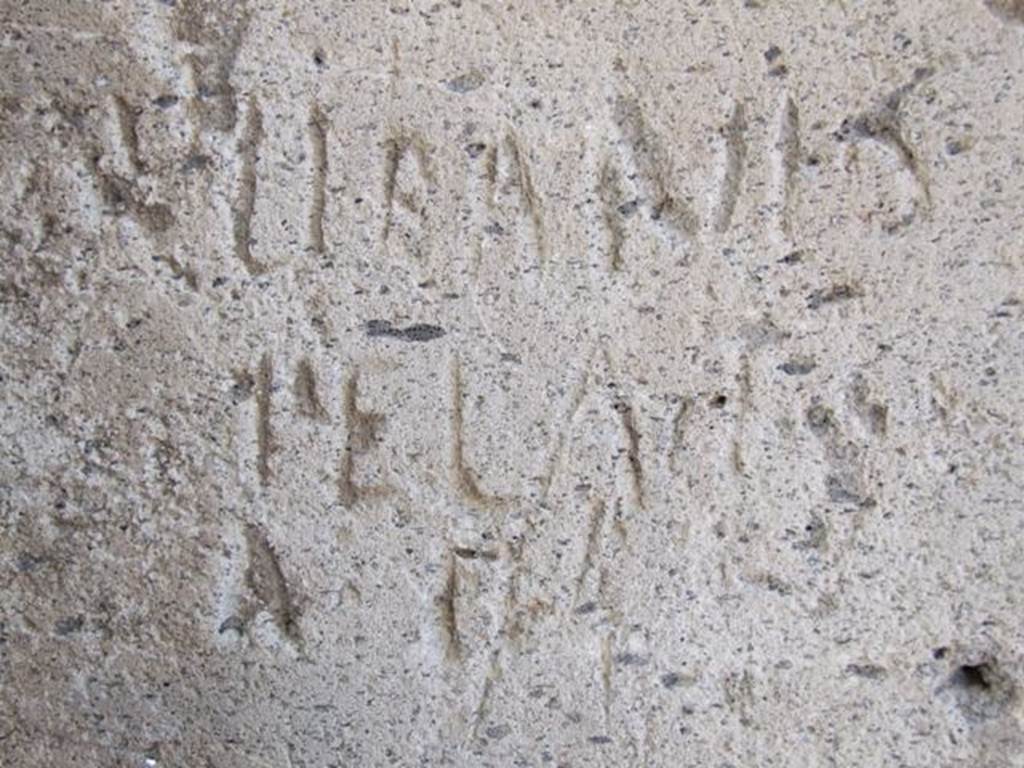 VII.13.14 Pompeii. December 2018. 
Stone block with inscription at corner of Vicolo della Maschera and Vicolo degli Scheletri. 
Photo courtesy of Aude Durand.
