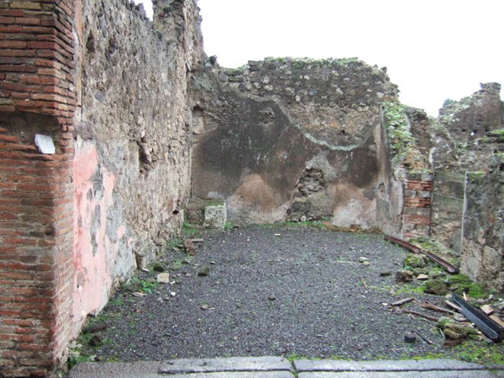 VII.13.25 Pompeii. December 2005. Looking east across rear room, on the right is the doorway that would have had wooden steps to VII.13.1.