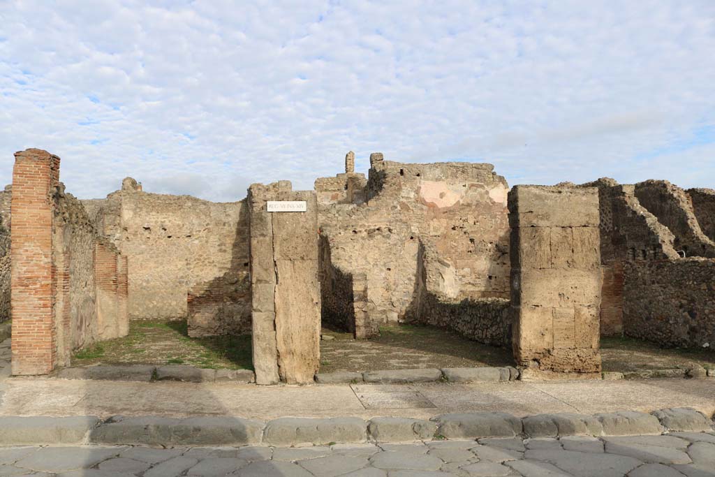 VII.14.1, Pompeii, on left. December 2018. 
Looking north to entrance doorways on Via dell’Abbondanza, with VII.14.2, in centre, and VII.14.3, on right. Photo courtesy of Aude Durand.
