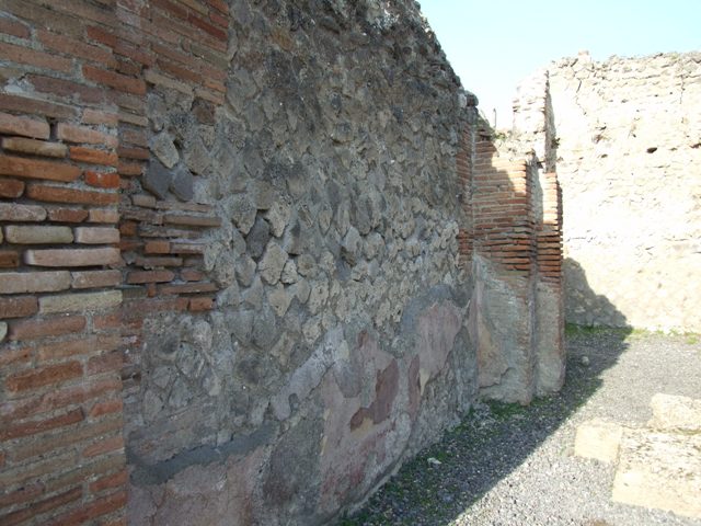 VII.14.1 Pompeii. December 2007. West wall of shop.