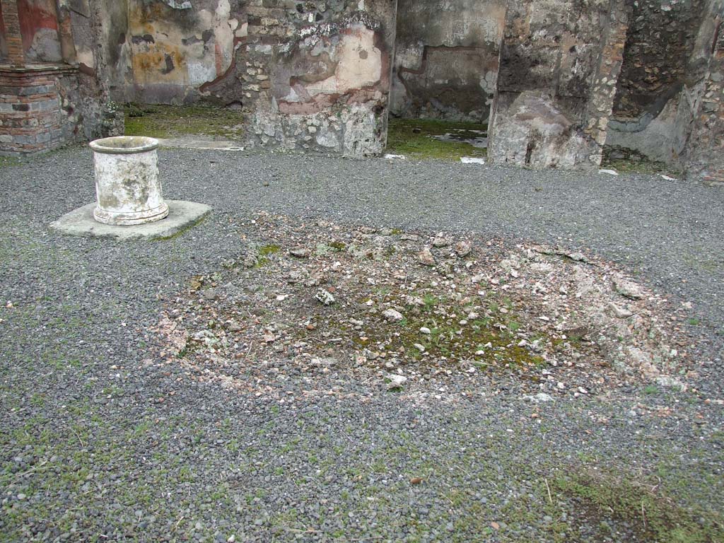 VII.14.5 Pompeii. March 2009. Room 1, remains of impluvium in atrium. Looking east.