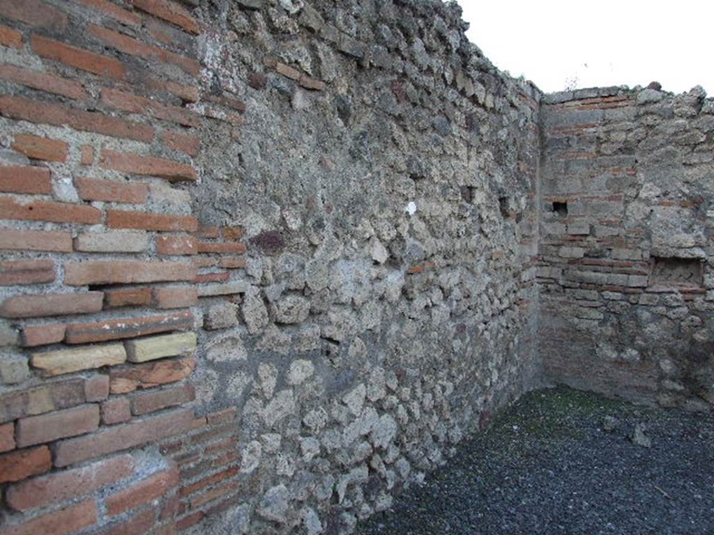 VII.14.10 Pompeii. May 2006. West wall and north-west corner of shop-room.