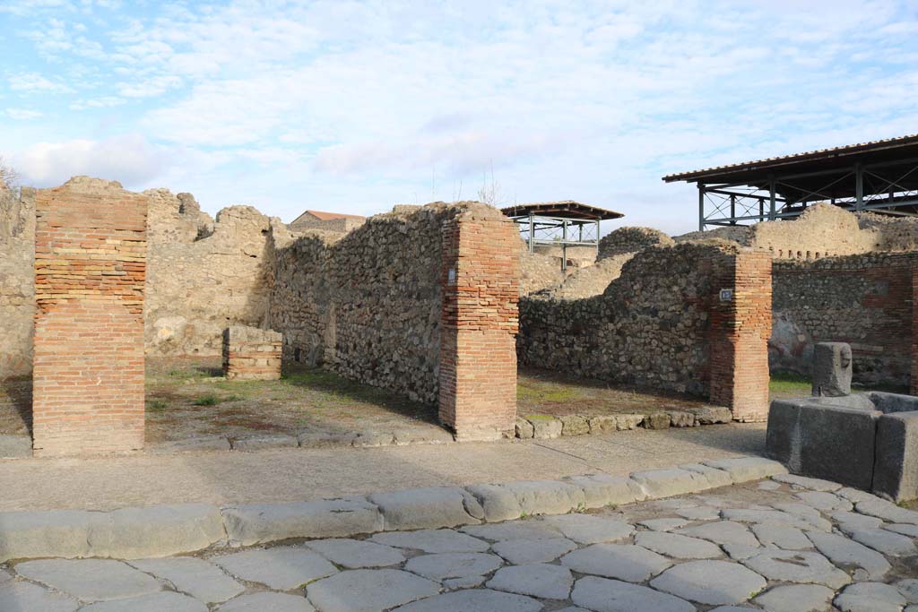 VII.14.12, Pompeii, on left. December 2018. 
Looking north-east to entrance doorways, with VII.14.13, on right. Photo courtesy of Aude Durand
