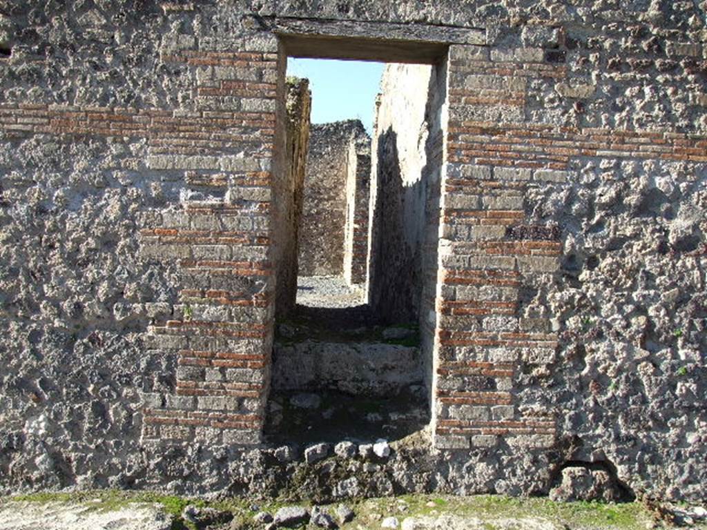 VII.14.16 Pompeii. December 2006. Entrance doorway to steps to upper floor, looking west.