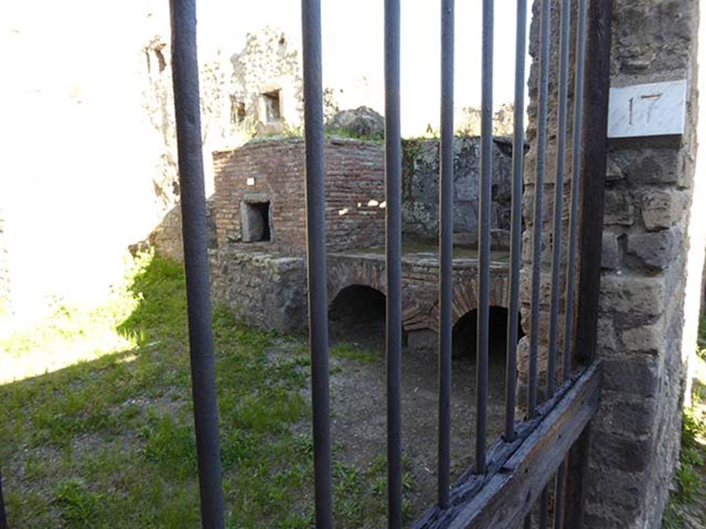 VII.14.19 Pompeii. April 2016.  
Looking south through kitchen entrance on Vicolo della Maschera. 
Note different number now on entrance doorway.
Photo courtesy of Michael Binns.

