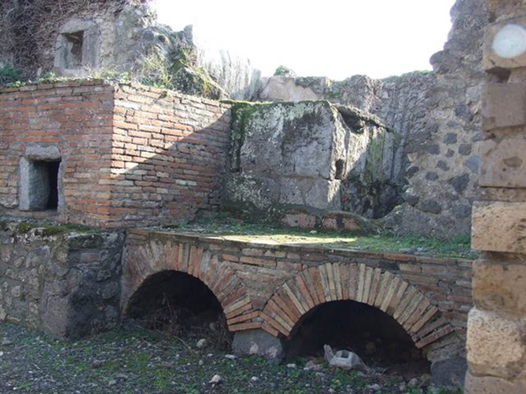 VII.14.19 Pompeii. December 2007. South side of kitchen, with oven and hearth.
