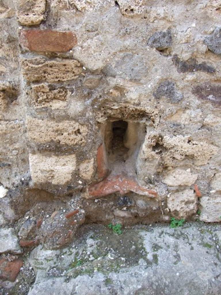 VII.14.19 Pompeii.  December 2007.  Drainage from house through wall out on to Vico della Maschera.