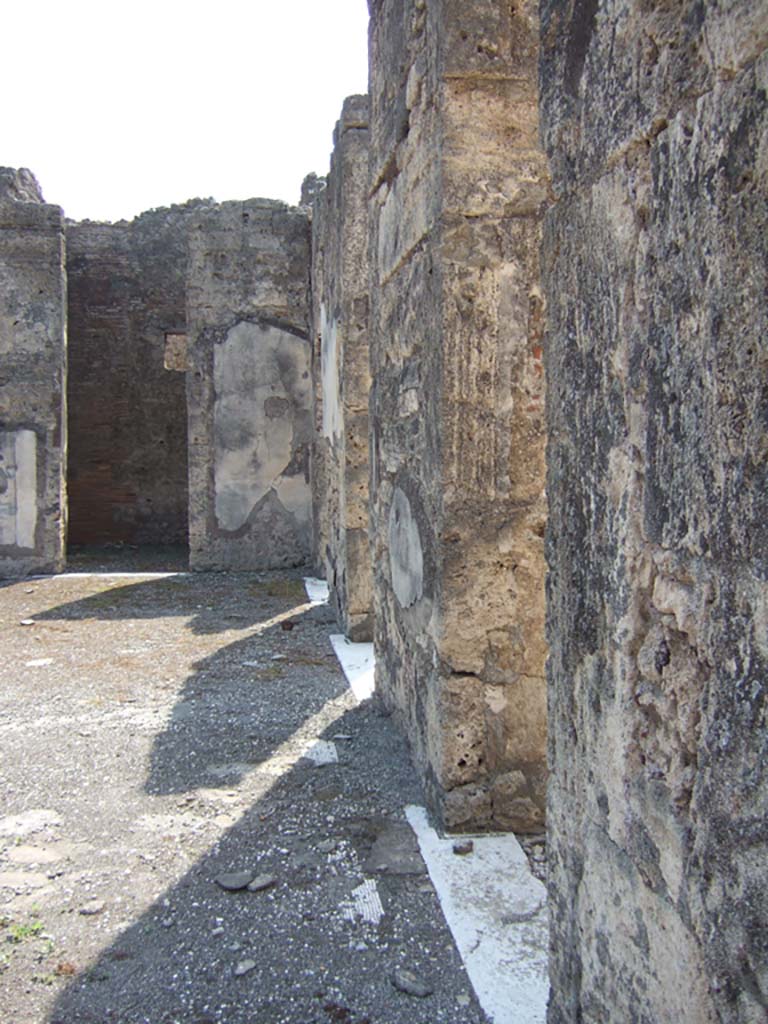 VII.15.2 Pompeii.  September 2005.  Doorways on west side of Atrium looking south.

