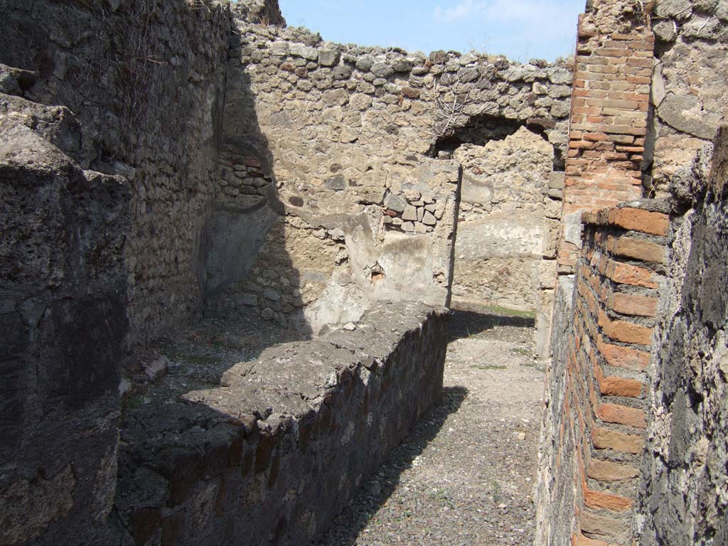VII.15.4 Pompeii. September 2005. Looking south across two rooms from second doorway on west side of entrance corridor.
