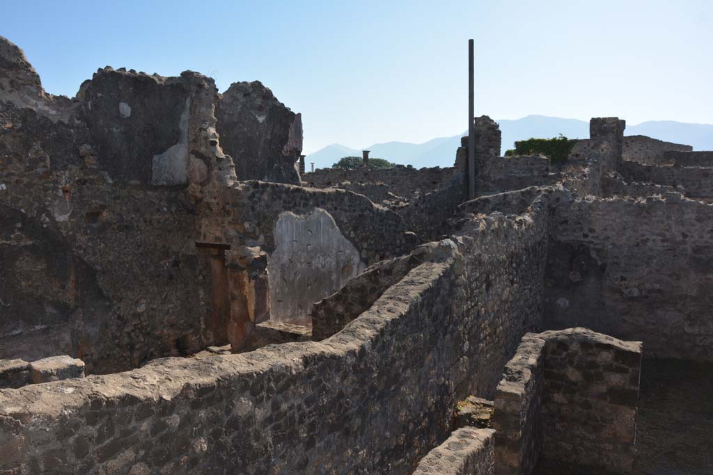  
VII.15.5 Pompeii. December 2018. 
Looking towards north wall of small garden with niche and site of cylindrical altar and lararium painting. Photo courtesy of Aude Durand.
