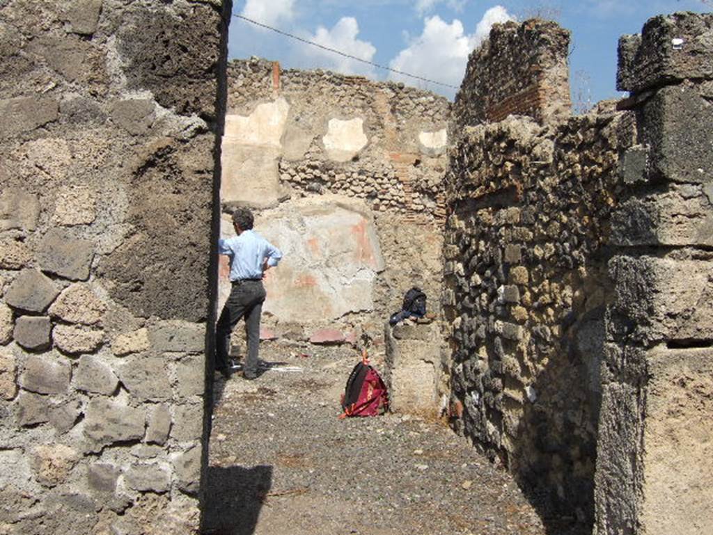 VII.15.7 Pompeii. September 2005. Looking across atrium to rear and east wall.