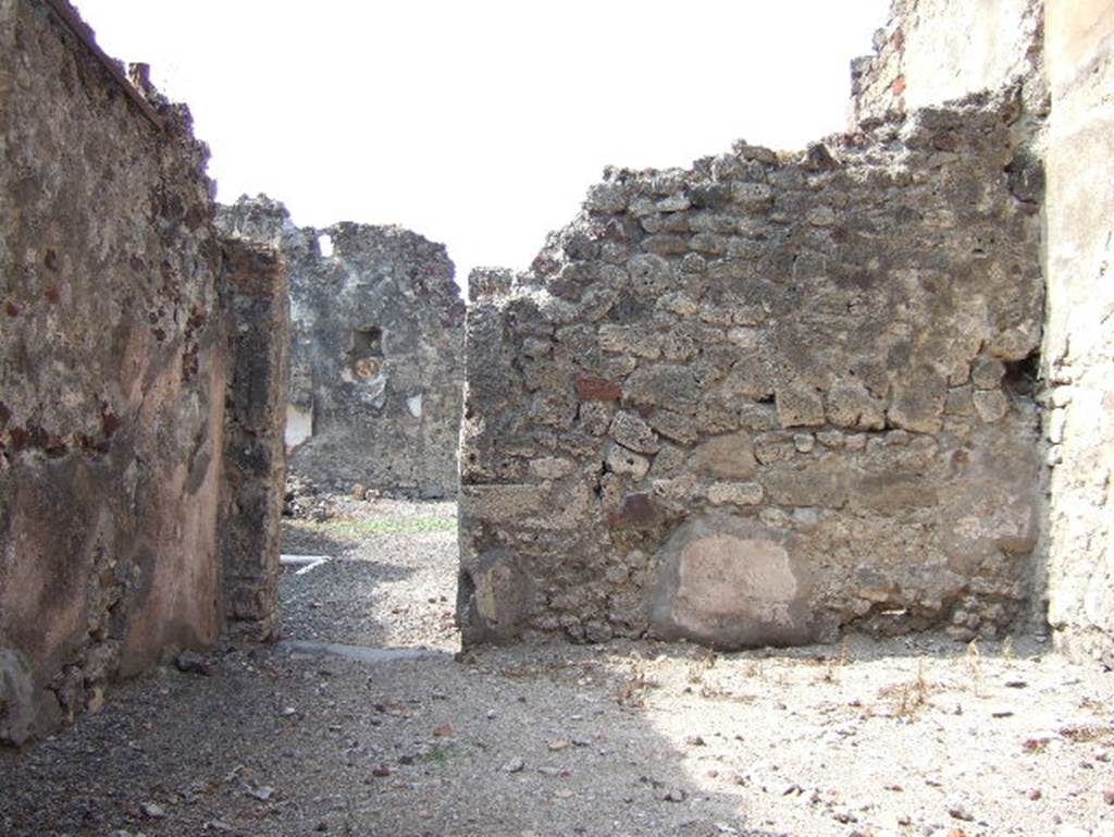 VII.15.10 Pompeii. September 2005. Looking west across popina, with doorway linking to atrium of VII.15.9.