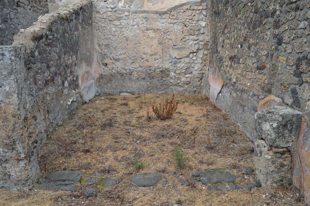 VII.15.12 Pompeii. March 2018. 
Looking north-east from garden area, across to room described by Boyce as “central atrium-like room”.
According to Eschebach, it was a triclinium. 
Foto Taylor Lauritsen, ERC Grant 681269 DÉCOR.

