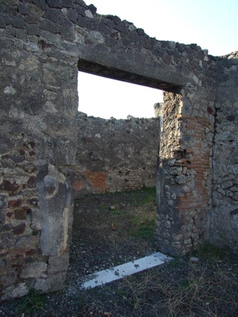 VII.15.13 Pompeii. December 2007. Door to Triclinium in north west corner of Atrium.
