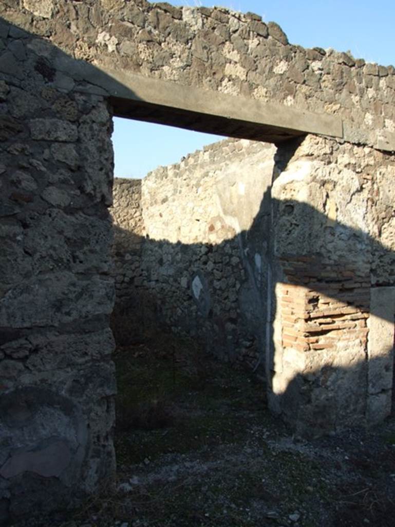 VII.15.13 Pompeii. December 2007. Doorway to oecus on west side of entrance corridor.