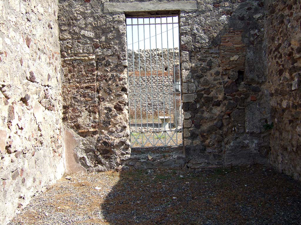 VII.15.14 Pompeii. September 2005. Looking east across oecus, towards doorway to VII.15.13.