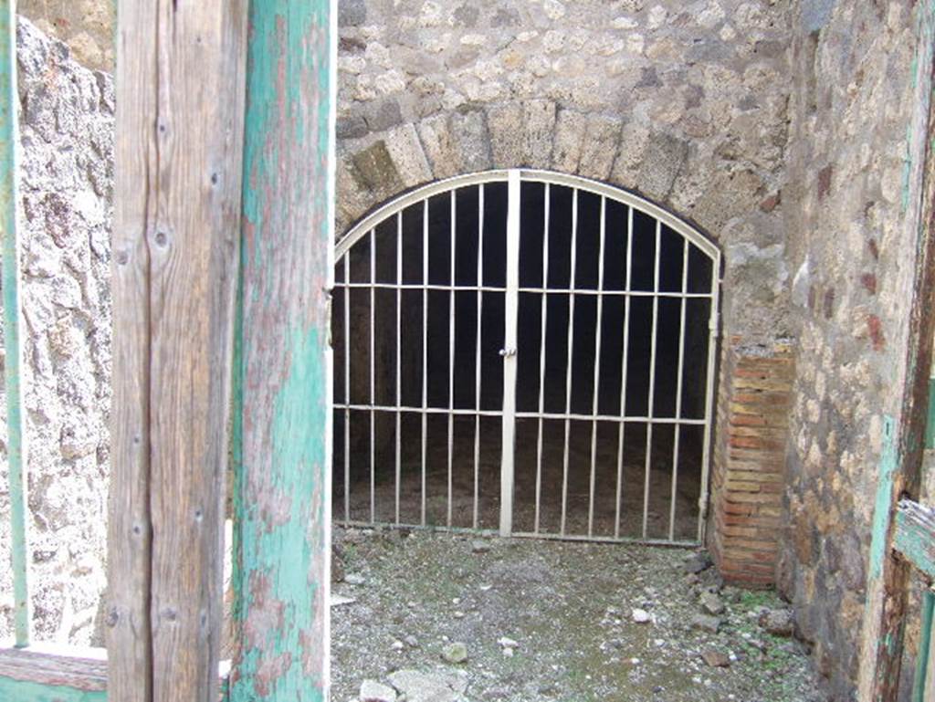 VII.15.16 Pompeii. September 2005. Looking south towards doorway to vaulted underground corridor of granary.
