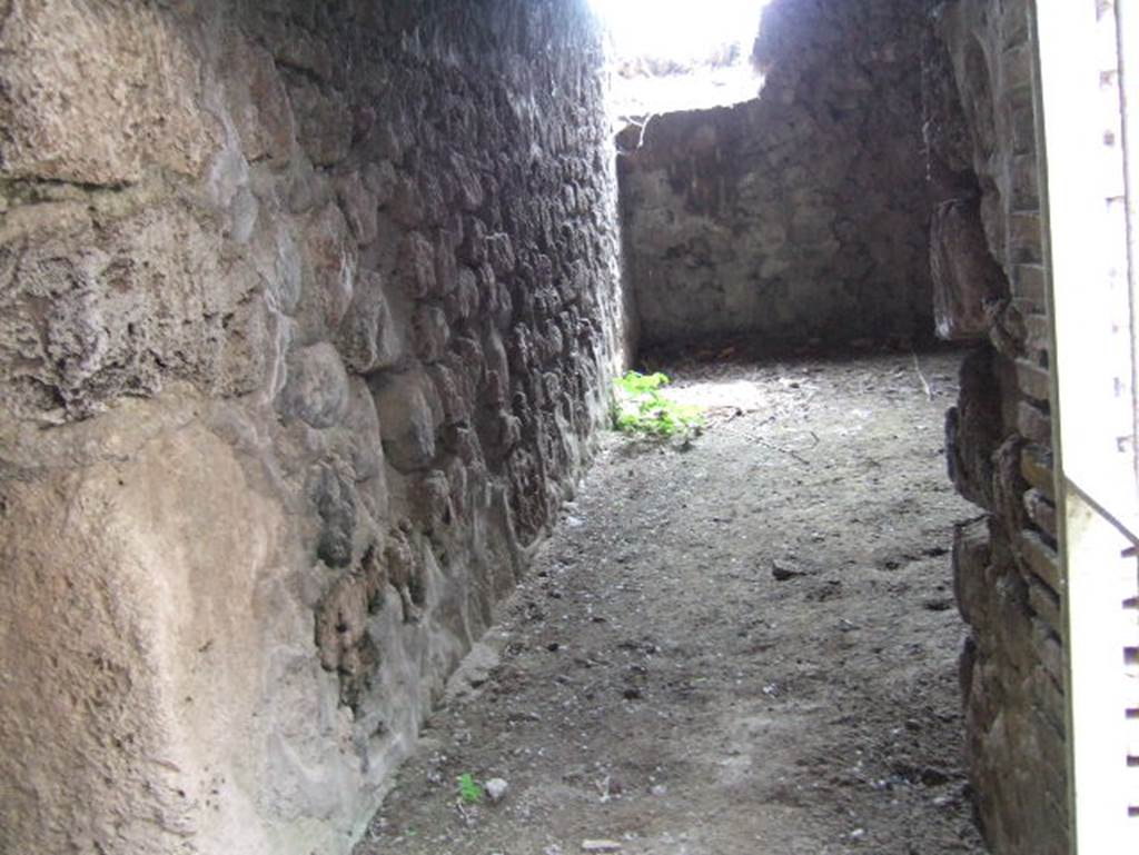 VII.15.16 Pompeii. May 2006. Looking through doorway on west side of corridor into room D with window in west wall.
