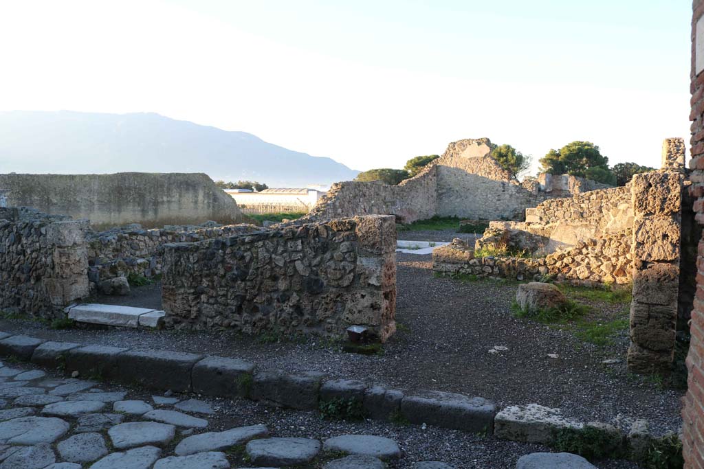 VII.16.11 Pompeii on right, and VII.16.10 on left. December 2018. 
Looking west to entrance doorways. Photo courtesy of Aude Durand.
